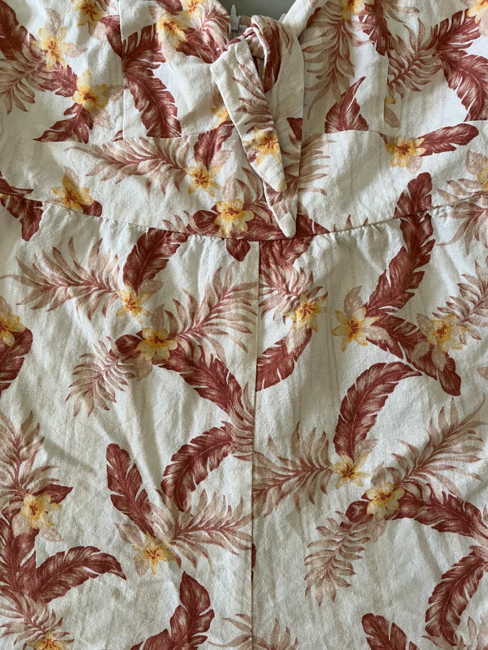 Piping hot White Flower Designed Summer Jump Suit