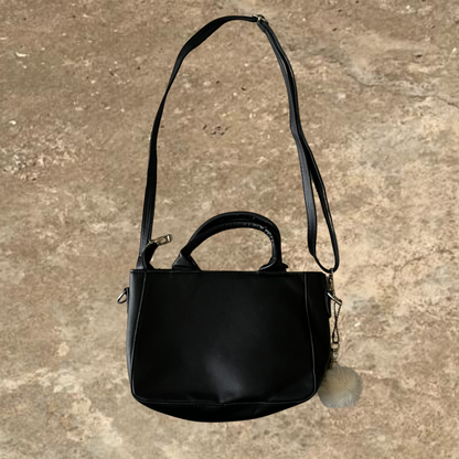Black Shoulder Bag With a Hanging Accessorie